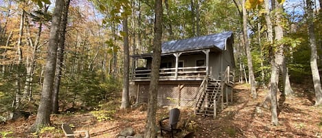 Cabin and fire pit in the fall