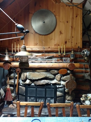 stone and brick fireplace w authentic lumber saw pine paneling