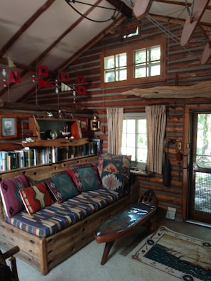 sofa- which comfortably sleeps 1- made from ship timbers of the Sawyer.
