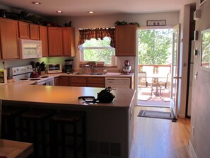 kitchen and deck for entertaining right outside the door. 