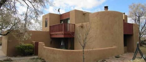 Exterior showing master balcony and patio