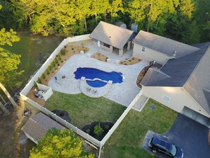 ariel view of pool and pool house