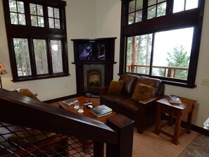 The living room includes sofas, HD Sat TV, fireplace and more views.