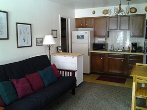 Fully furnished kitchen, half-bath and double futon on downstairs, ground level.