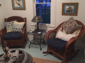 Parlor room seating in front of the wood stove