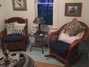 Parlor room seating in front of the wood stove