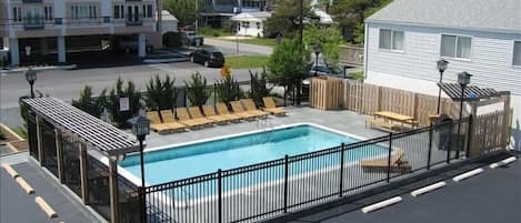 View of pool and grill area from condo