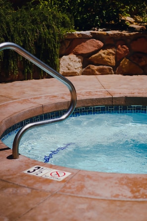 Spa is located by the pool.