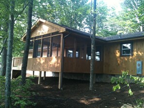 Back of house and screened-in porch.