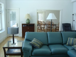 Dining room has seating for 8, doors go out to porch and deck.