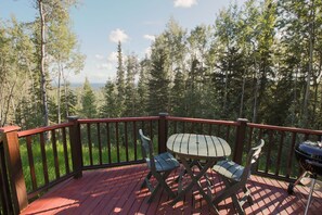 Deck with seating area and small grill