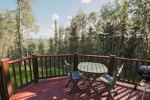 Deck with seating area and small grill