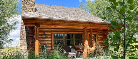 Charming two-story hand-peeled log cabin set amidst the aspens.