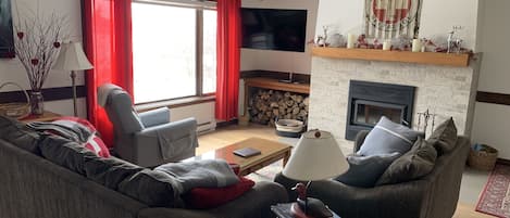 Cosy living room with smart TV and fireplace