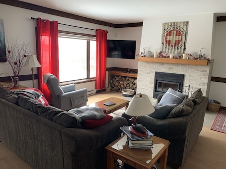 Cosy living room with smart TV and fireplace