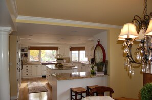 Striking granite  kitchen with over sized island and all the tools you need!