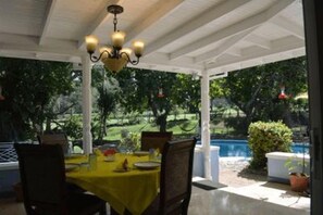 Pool side patio provides a lovely space for outdoor dining. 