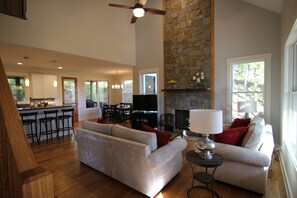 Living Room with 49" Roku TV, Sonos music, and wood burning fireplace.
