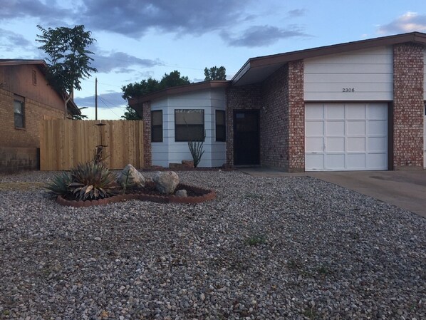 Front of house with attached one car garage