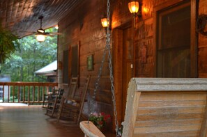 Our relaxing covered porch has rockers, swings, and ceiling fans.