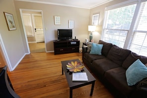 the living room is convenient to the kitchen and provides space to relax