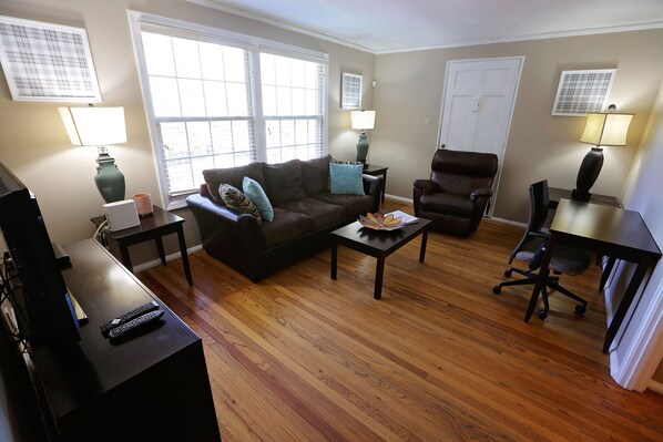 The living room has all you need to watch or stream TV, work or relax.