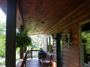 Comfy porch rockers, cozy bench, gas grill