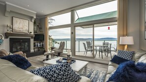 Living room with floor to ceiling views and heated floors throughout