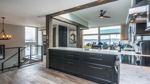 Large bright kitchen with ocean views