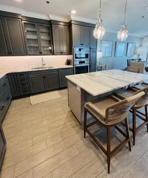 The kitchen area is spacious with gorgeous marble countertops and very nice appliances!