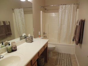 Guest Bathroom with Tub/Shower and Tile floor