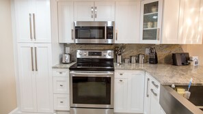 Remodeled modern kitchen with all stainless steel appliances