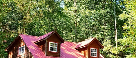 Cedar Sided Cabin with Red Metal Roof