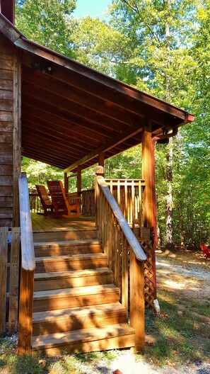 Long Shaded Front Porch Overlooking The Driveway