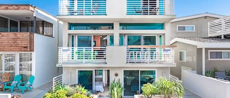 43rd Street view of the entire building that is comprised of 2 separate, side by side condos. This listing information only pertains to the left, 3-level condo. The right side condo can also be rented when available.