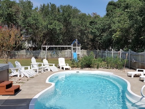 Cool off in the pool or relax in the hot tub. Kids will enjoy the playset.
