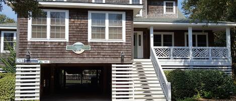 Street view of old Nags Head style cottage. Parking for 6-7 cars.