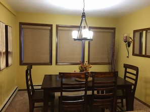 Dining area seats 7 with 4 stools at the counter 