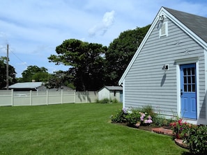 Very large side and back yard to BBQ, Sunbath, and enjoy the summer gardens!