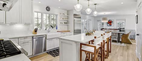 Welcoming luxury kitchen with professional appliances and Sonos