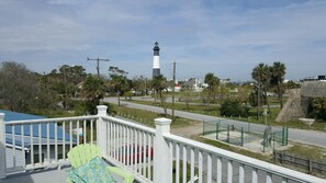 View of lighthouse from the deck. Lighthouse is  west of the home, beach is east