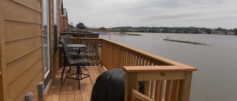 Deck facing Lake with table + 2 chairs and coal Bar-B-Q