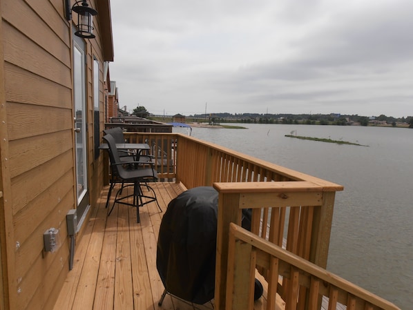 Deck facing Lake with table + 2 chairs and coal Bar-B-Q