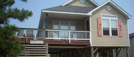 Front of the house. Sitting on the Adirondack chairs is great.