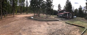 Overview photo of the Cabin.  Plenty of parking, sitting and playing areas.