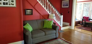 Family Room looking into the sunroom. Stairs go to bedrooms upstairs 