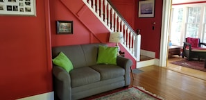 Family Room looking into the sunroom. Stairs go to bedrooms upstairs 