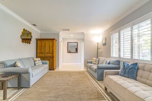living room with comfy sofas and beige sofa is a sofa bed