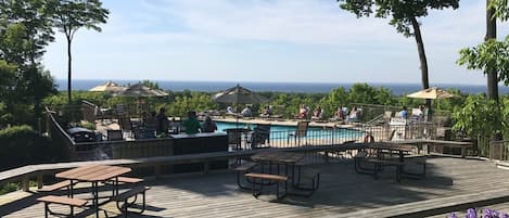 Multiple heated outdoor pools overlooking the lake.