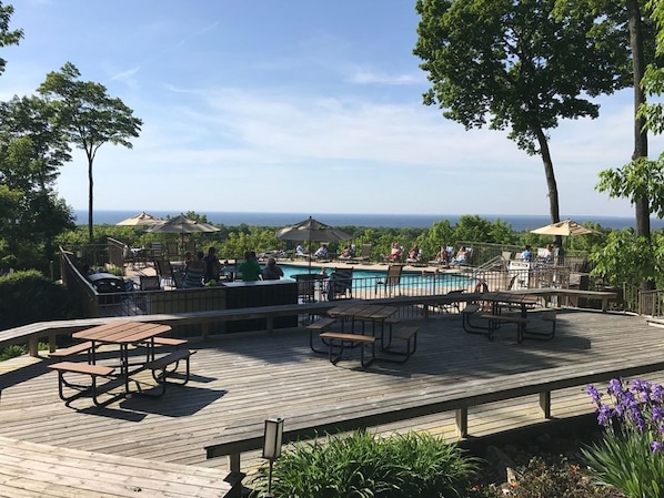 Multiple heated outdoor pools overlooking the lake.